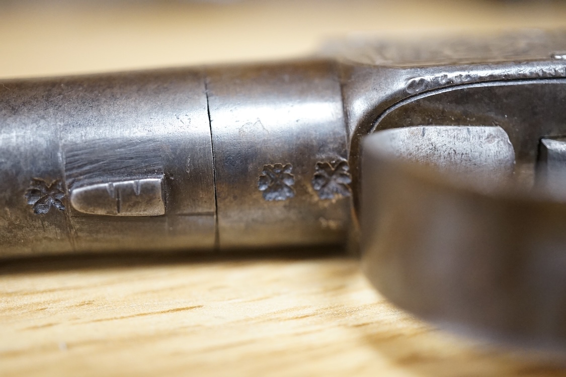 A boxlock percussion pocket pistol with turn off barrel, Birmingham proofs, trophy engraved frame, and slab walnut butt